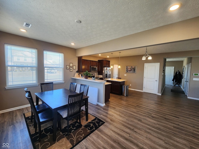 dining room featuring recessed lighting, visible vents, baseboards, and dark wood-style floors