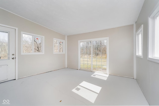 unfurnished room featuring plenty of natural light