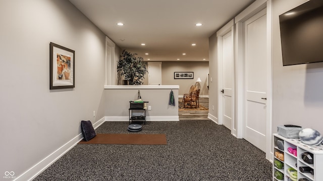 hall with carpet flooring, recessed lighting, and baseboards