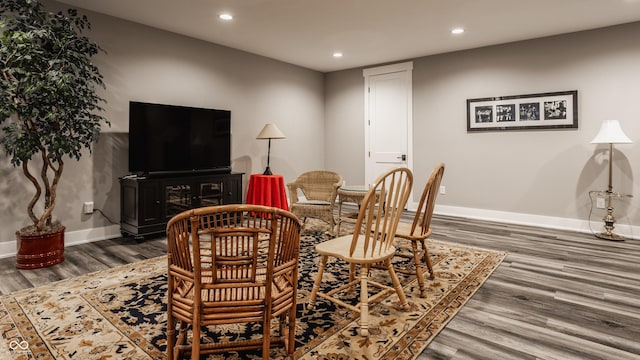 dining area with recessed lighting, baseboards, and wood finished floors