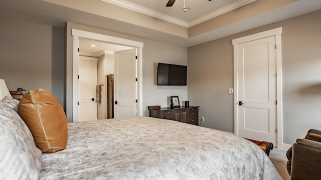 bedroom with a ceiling fan and ornamental molding