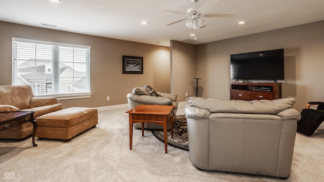 living room with a ceiling fan, recessed lighting, visible vents, and light carpet