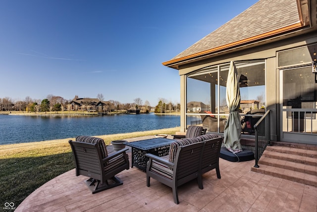 view of patio / terrace with a water view