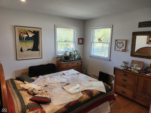 bedroom featuring wood finished floors