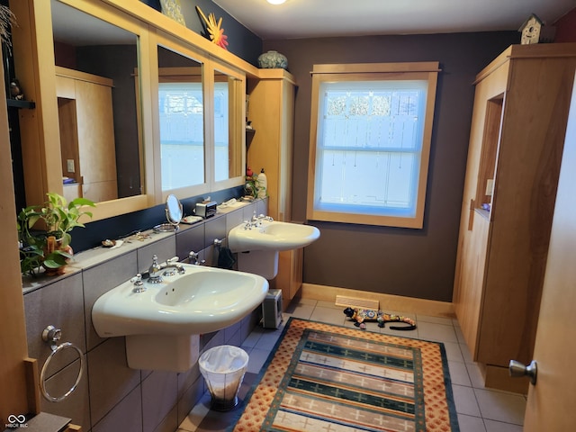 bathroom featuring visible vents, baseboards, and tile patterned flooring