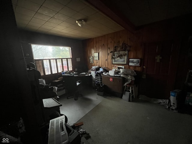 office space with wooden walls and beamed ceiling