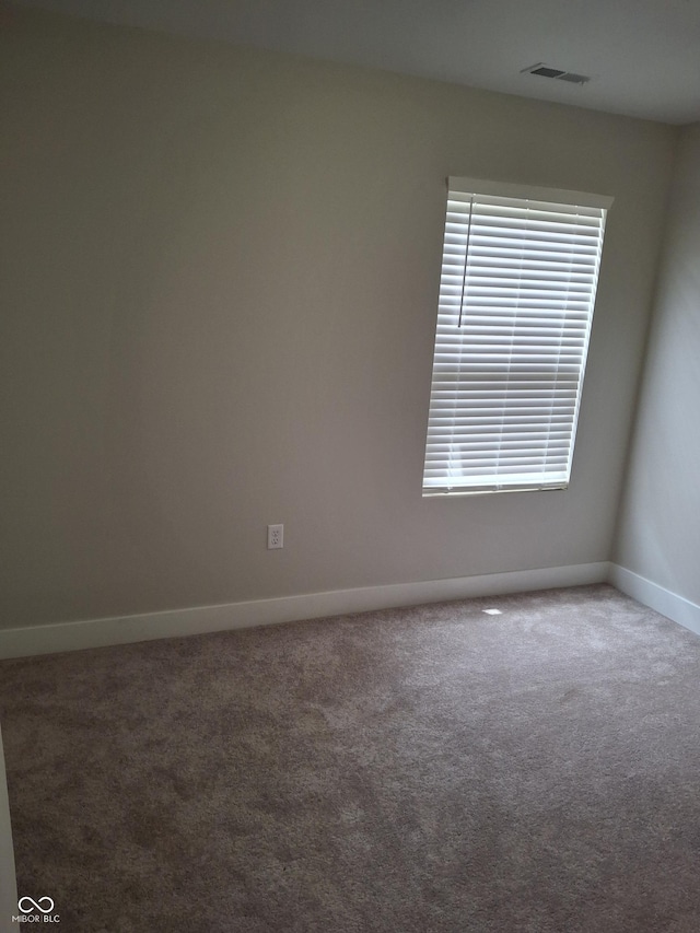 1974 Ralston Ave, Indianapolis, IN 46218 - carpeted empty room featuring baseboards