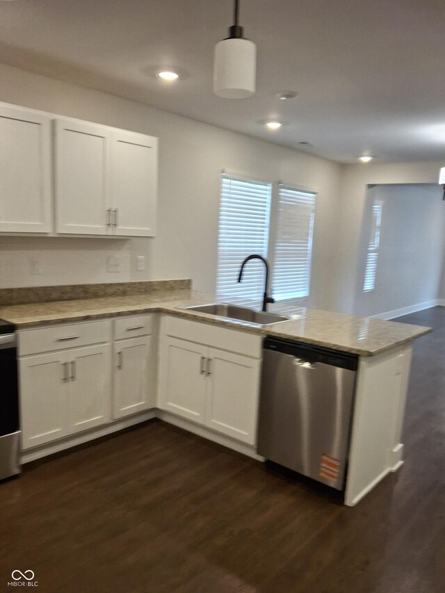1974 Ralston Ave, Indianapolis, IN 46218 - kitchen with dishwasher, a peninsula, dark wood-style floors, white cabinets, and recessed lighting