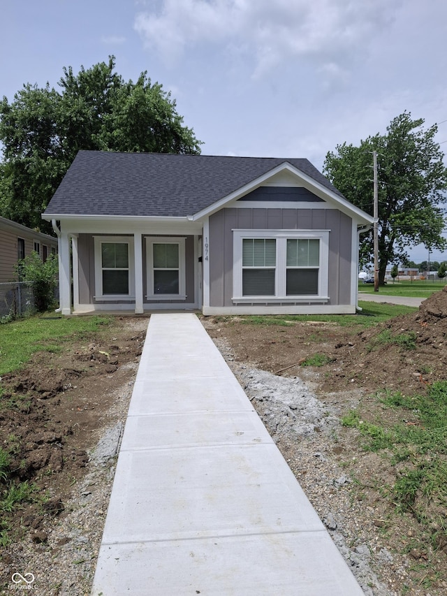 1974 Ralston Ave, Indianapolis, IN 46218 - single story home featuring roof with shingles and board and batten siding