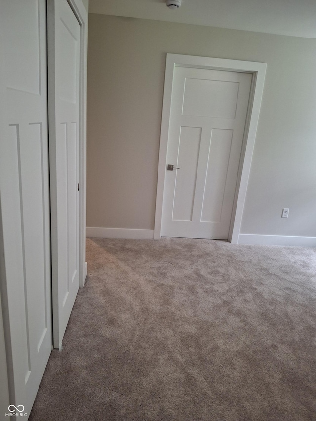 1974 Ralston Ave, Indianapolis, IN 46218 - unfurnished bedroom featuring carpet floors and a closet
