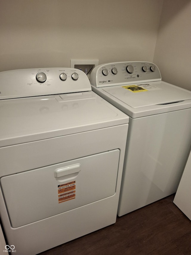 1974 Ralston Ave, Indianapolis, IN 46218 - laundry area with separate washer and dryer and dark wood-style floors