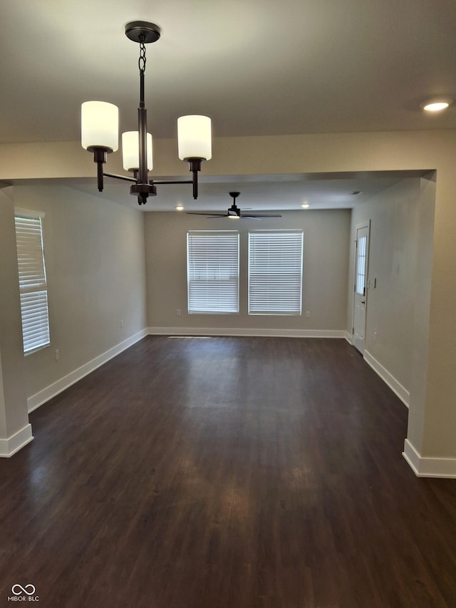 1974 Ralston Ave, Indianapolis, IN 46218 - spare room with a chandelier, dark wood finished floors, ceiling fan, and plenty of natural light