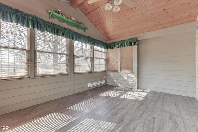 unfurnished sunroom with a ceiling fan, vaulted ceiling with beams, wood ceiling, and plenty of natural light