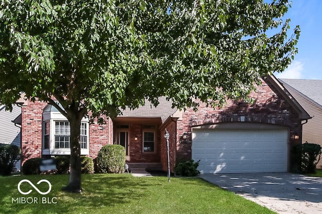 view of front of house featuring brick siding, driveway, an attached garage, and a front yard