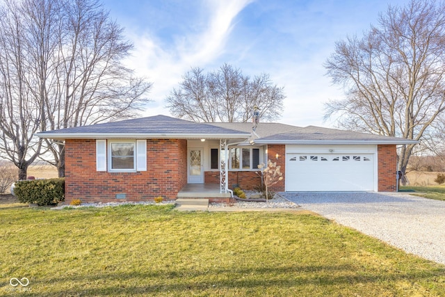 ranch-style house featuring a front yard, brick siding, driveway, and crawl space