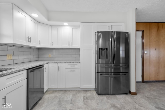 kitchen with tasteful backsplash, stainless steel fridge with ice dispenser, light stone counters, dishwashing machine, and white cabinetry