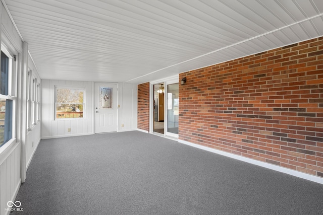 unfurnished sunroom featuring plenty of natural light