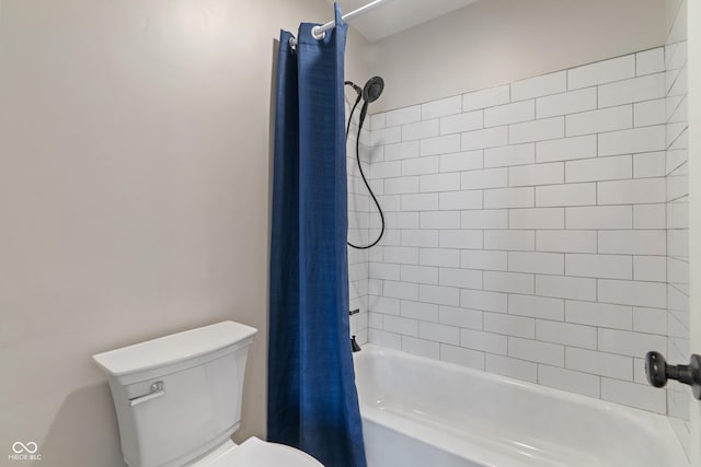 bathroom featuring toilet and shower / bath combo