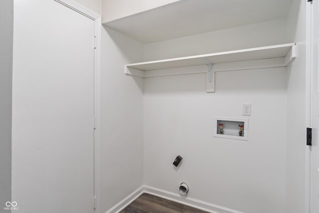 laundry room featuring baseboards, washer hookup, dark wood-style flooring, and laundry area