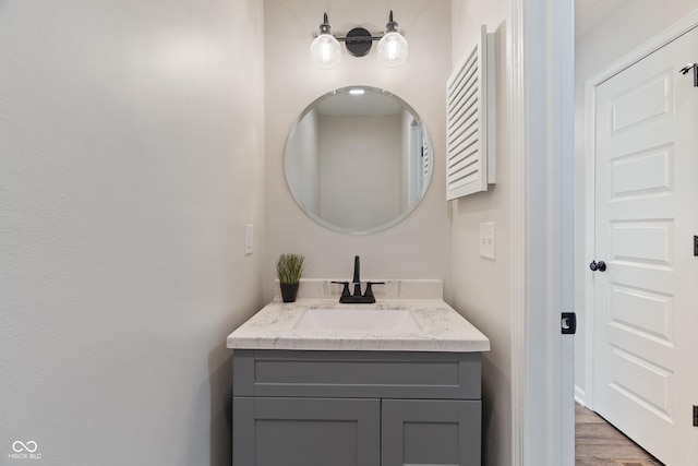 bathroom featuring vanity and wood finished floors