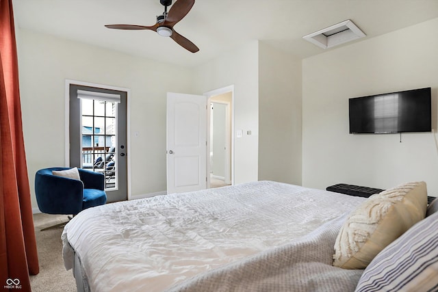 bedroom featuring attic access, a ceiling fan, and carpet floors