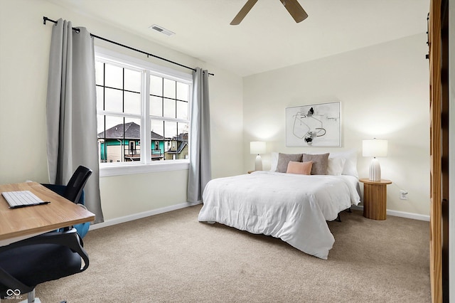 bedroom featuring a ceiling fan, baseboards, visible vents, and carpet floors