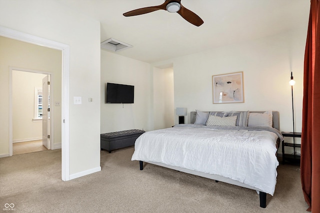 bedroom with baseboards, carpet flooring, attic access, and ceiling fan