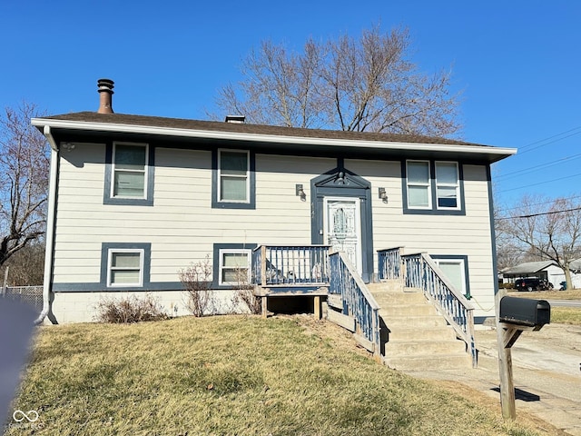 bi-level home with a front yard