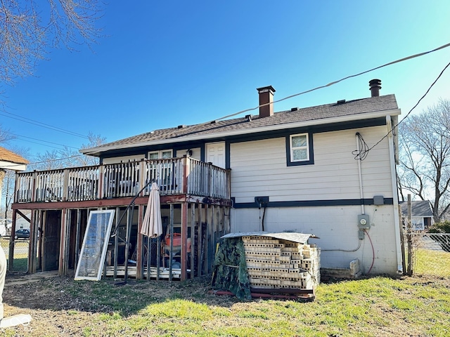 back of house with stairs, fence, a chimney, and a wooden deck