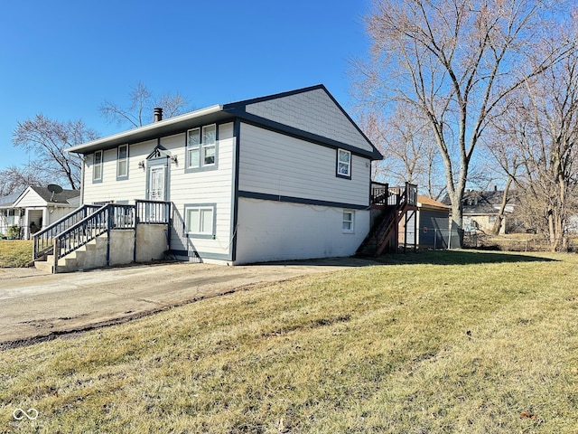 exterior space featuring a yard and stairs