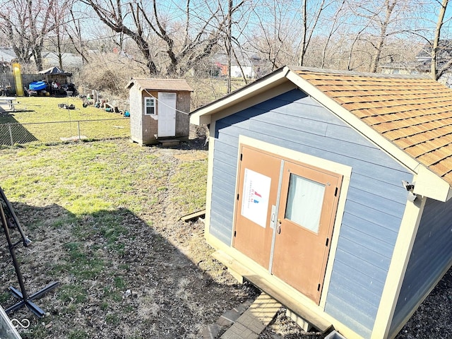 view of shed with fence