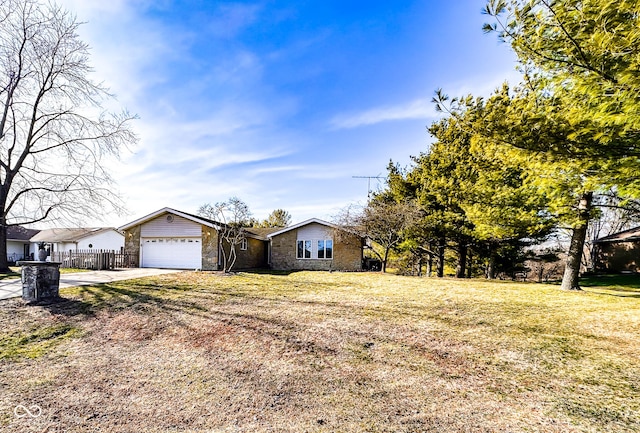 view of front of home with fence, concrete driveway, a front lawn, a garage, and stone siding