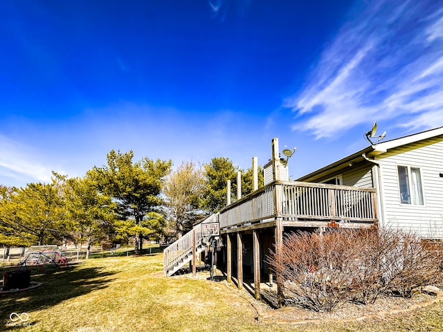 view of yard featuring stairs and a wooden deck