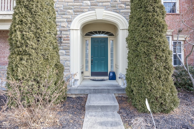 entrance to property with stone siding