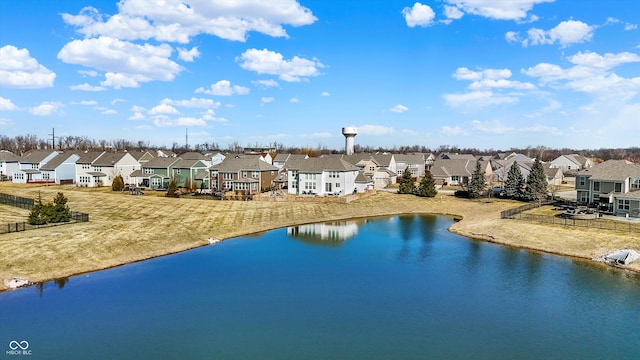 aerial view featuring a residential view and a water view