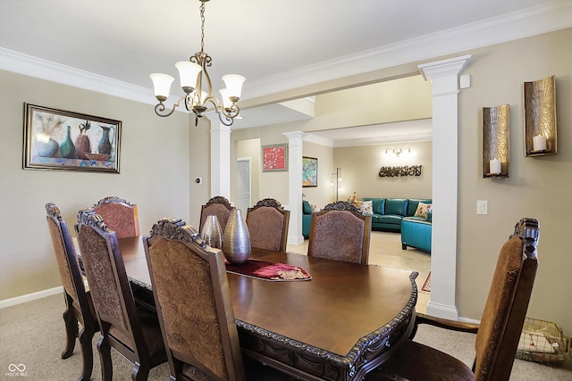 dining room featuring decorative columns, baseboards, a notable chandelier, and ornamental molding