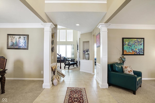 entryway with baseboards, light colored carpet, ornamental molding, decorative columns, and light tile patterned flooring