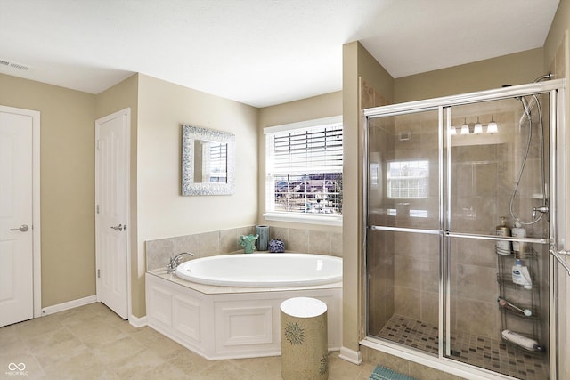 full bath featuring baseboards, visible vents, tile patterned flooring, a shower stall, and a garden tub