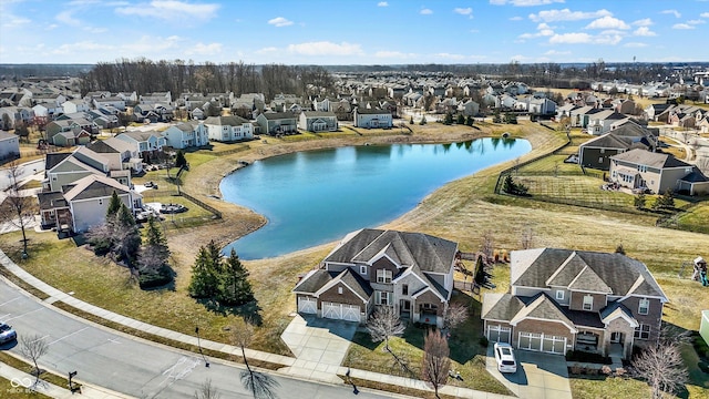 aerial view with a residential view and a water view