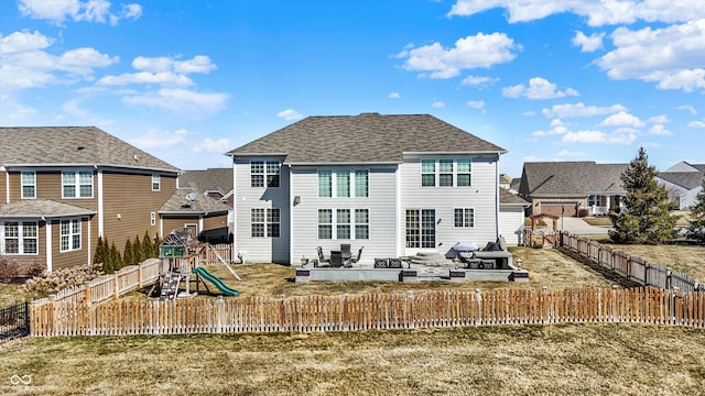 rear view of property with a patio area, a playground, a fenced backyard, and a residential view