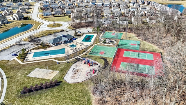 drone / aerial view with a residential view and a water view