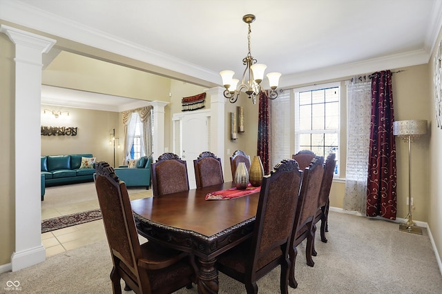 dining space with ornamental molding, light carpet, light tile patterned flooring, a notable chandelier, and ornate columns