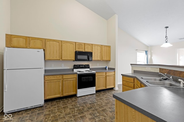 kitchen with dark countertops, black microwave, electric range oven, freestanding refrigerator, and a sink