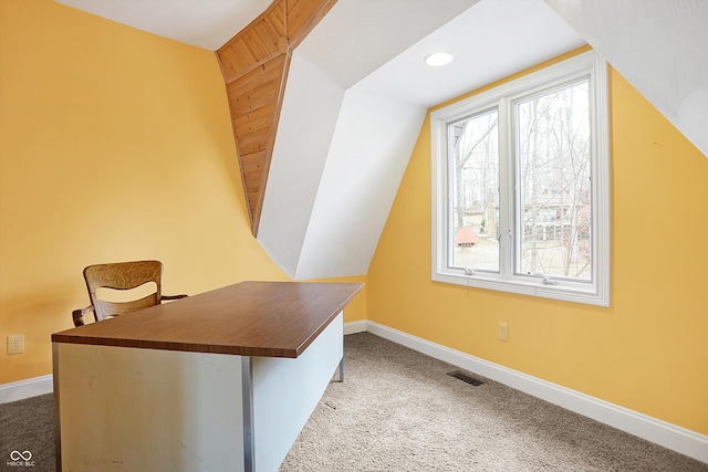 office space with carpet flooring, plenty of natural light, baseboards, and vaulted ceiling