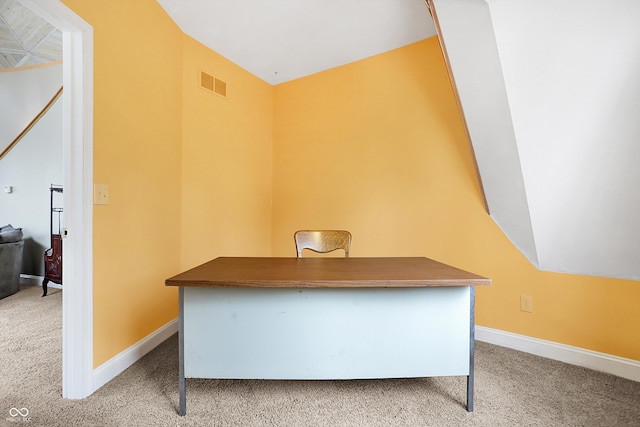 carpeted office with visible vents and baseboards