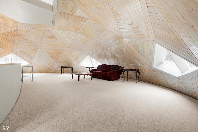 additional living space with carpet flooring, high vaulted ceiling, and wooden walls