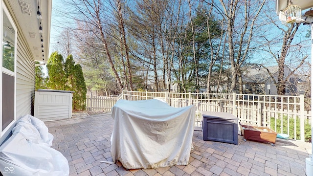 view of patio / terrace featuring fence