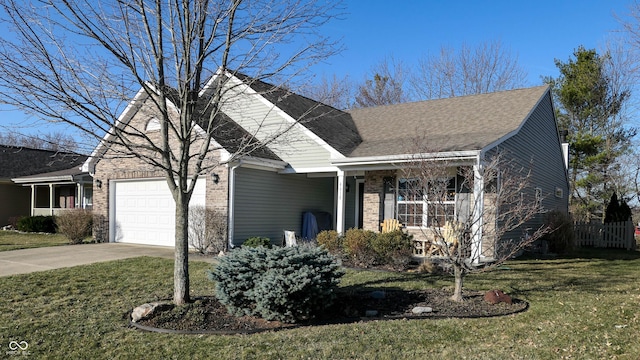 view of front facade featuring concrete driveway, a front yard, a shingled roof, a garage, and brick siding