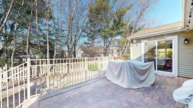 view of patio featuring fence