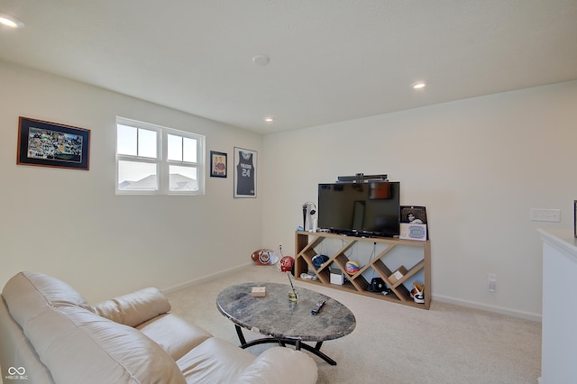 carpeted living room with recessed lighting and baseboards